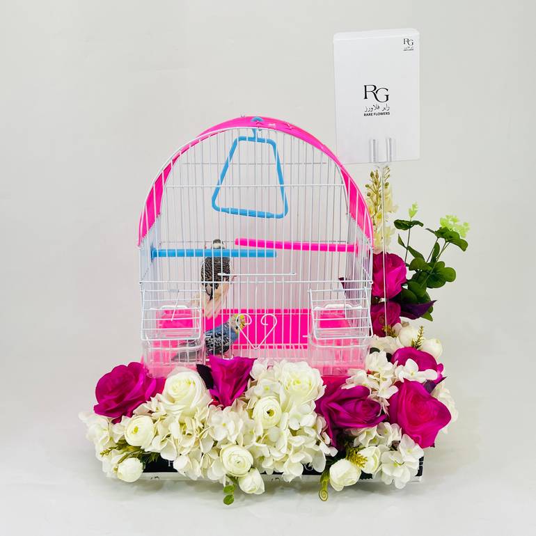 A pair of budgies with a cage decorated with colorful artificial flowers.04