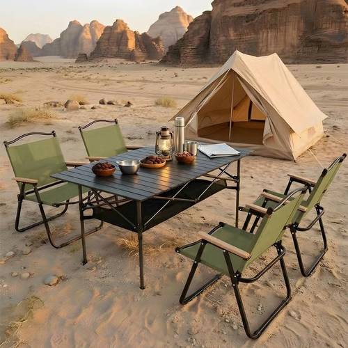 5-piece camping set | Height-adjustable table with mesh storage basket, and 4 green chairs with black frames - available in multiple colors and sizes.