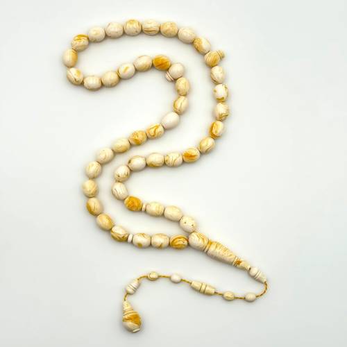 مستكة ابيض عرق اصفر ( بيضاوي )