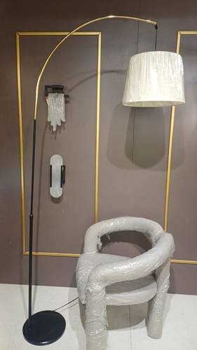Modern lamp, 220 cm high, with a black marble base, two black and gold columns, and a movable white soft fabric cover.