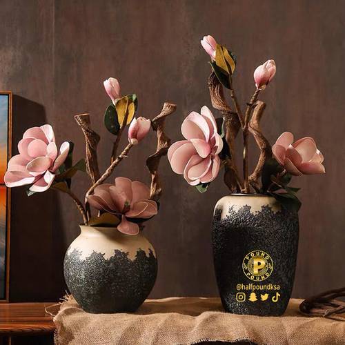 Handmade rough ceramic flower vase in brown