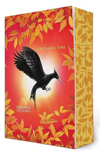 Catching Fire: Deluxe Edition (The Hunger Games, Book Two) Paperback – February 4, 2025 by Suzanne Collins