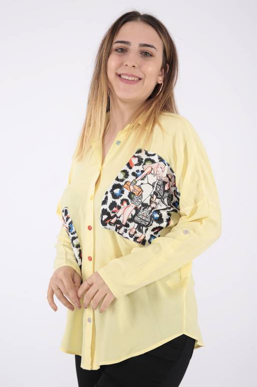 بلوزة باللون الأصفر الأنيق بكم طويل وياقة رسمية وطبعات جميلة لإضفاء لمسة عصرية