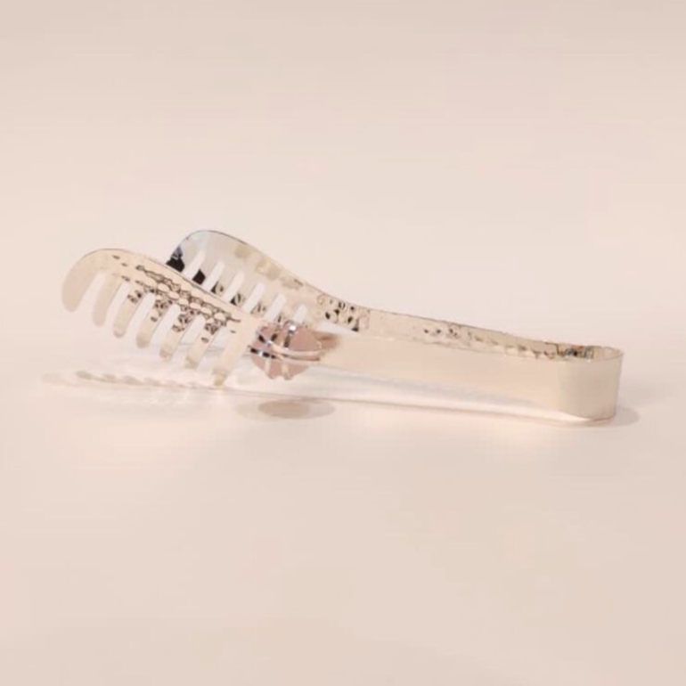 Silver serving clip with precious stone 