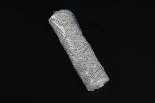 Spool of interwoven braided cotton thread 30