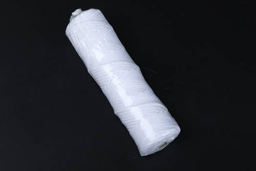 A spool of braided cotton thread . thickness 45