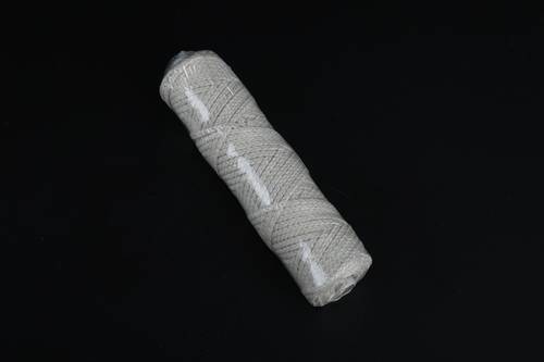 Spool of interwoven braided cotton thread 50