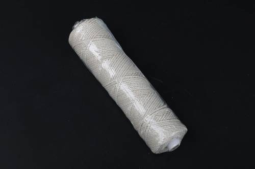 Spool of interwoven braided cotton thread 18