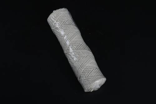 Spool of interwoven braided cotton thread 35