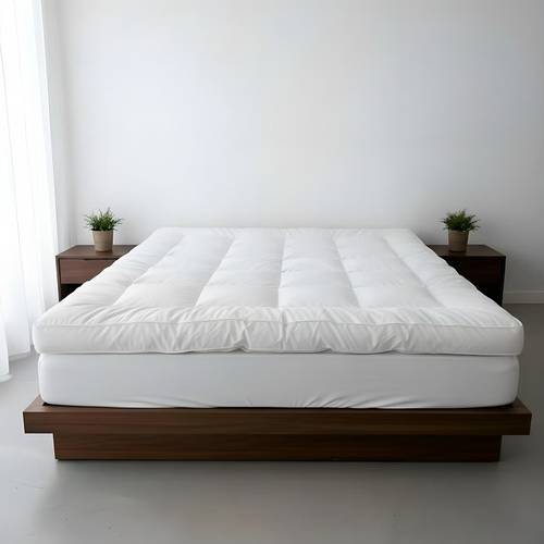 Bremen White Microfiber Mattress Pad with Elastic Corners, providing stability, comfort, and softness during sleep. It securely fits and stays attached to the mattress.