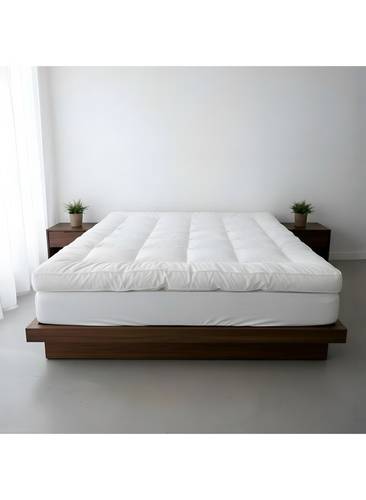 Bremen White Microfiber Mattress Pad with Elastic Corners, providing stability, comfort, and softness during sleep. It securely fits and stays attached to the mattress.