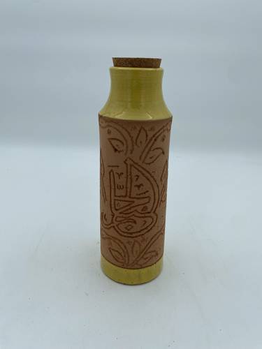 قارورة طراز مديني 600 ملي واكثر  (الجبار) اصفر