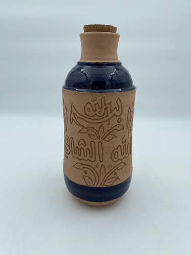 قارورة طراز مديني (بسم الله الشافي) كحلي 1.5 لتر  تقريبا