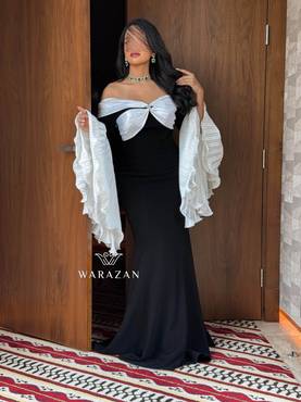 فستان سهرة راقي بأكمام بيليسيه واسعة 
