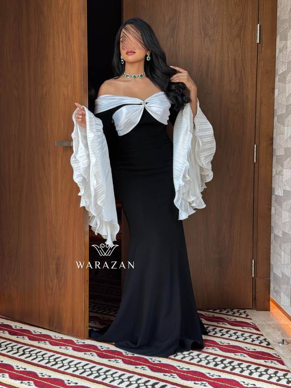 فستان سهرة راقي بأكمام بيليسيه واسعة 