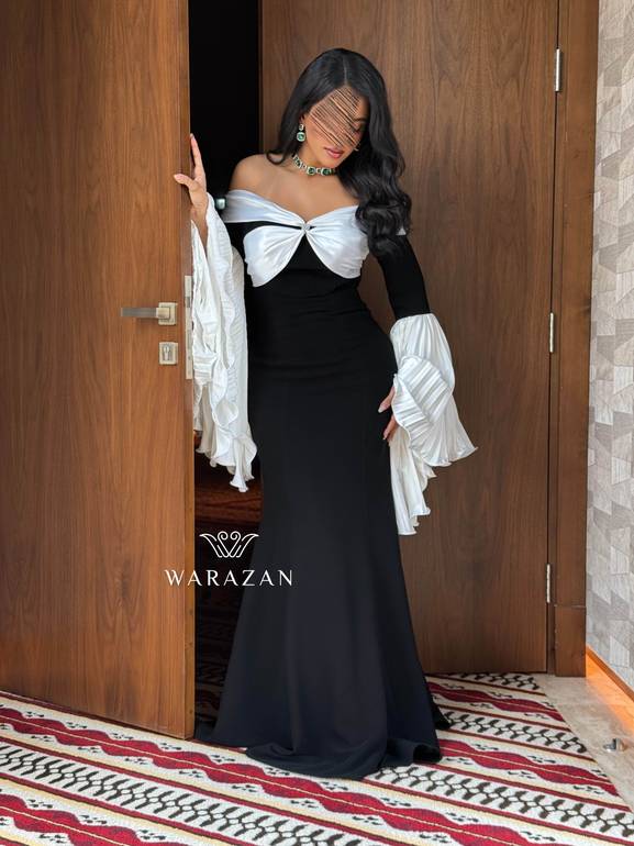 فستان سهرة راقي بأكمام بيليسيه واسعة 