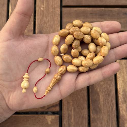 كوك فاتح (خامة طبيعية) عدد الخرز 33 مقاس الخرز 10*13ملي 