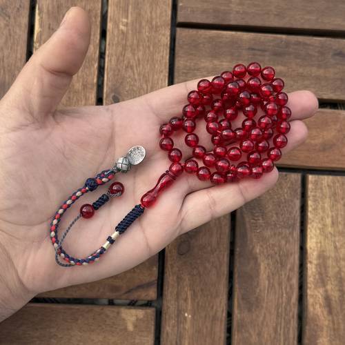 ما يسمى بكلايت (خامة مصنعة جديدة) عدد الخرز 63 مقاس 8ملي بكركوشة قماش من تفصيلنا مضاف اليه فضة شكل هلل