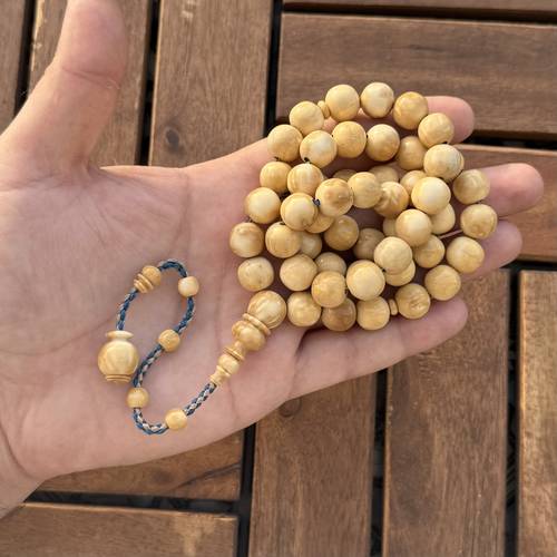 كوك ابيض (خامة طبيعية) عدد الخرز 51 مقاس الخرز 11*11.5ملي خراطة ورشة مصنع النجوم موديل عقود