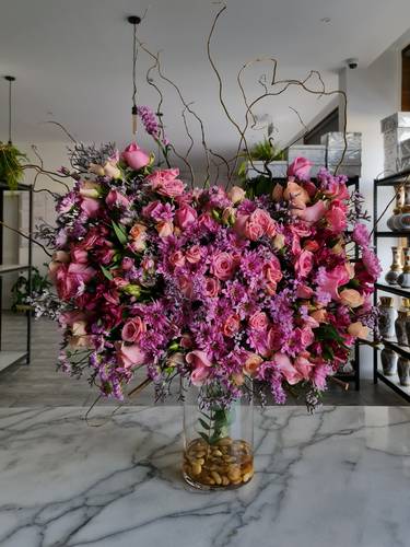 Glass Vase with purple and pink flowers 