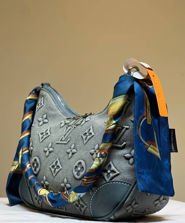 Louis Vuitton Boulogne bag denim fabric embossed monogram pattern.