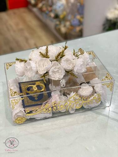 Dowry box with artificial flowers and accesories