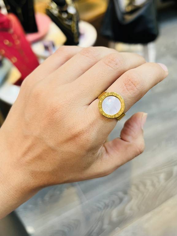 Gold bvlg*ri ring white stone 