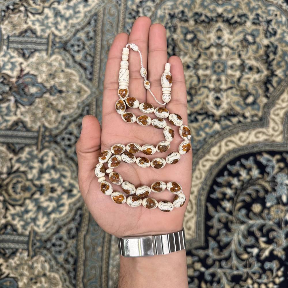  عاج ناب الفيل مطعّم بالكهرمان 