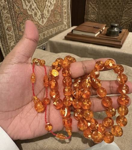 سبحة كهرمان ضغط فاخر بتطعيمات عاج الفيل – 64 جم | 49 خرزة | 12 ملم