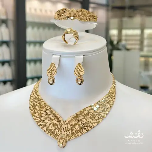 طقم ذهب عيار21 جناح الصقر 