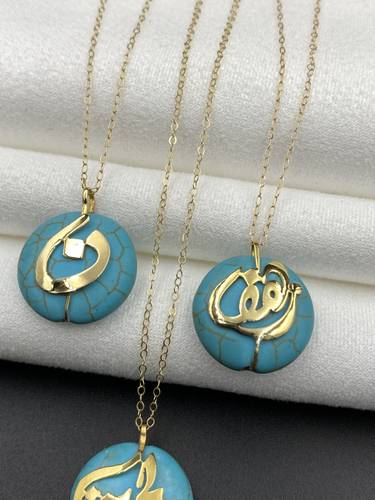Gold necklace with turquoise synthetic stone