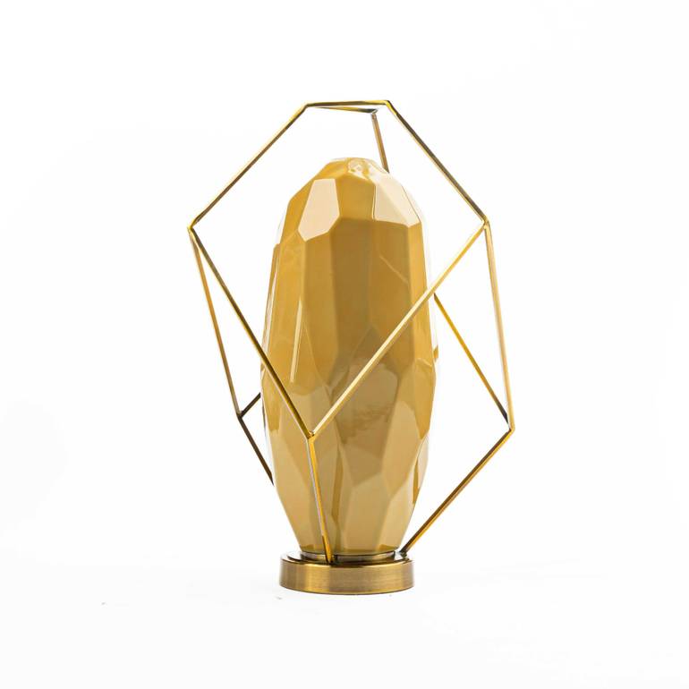 Ceramic vase with a golden base