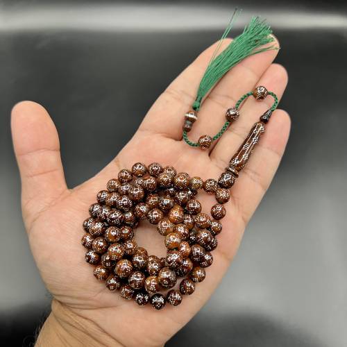 خشب كوك مطعّم بالفضة 99 خرزه 🤎