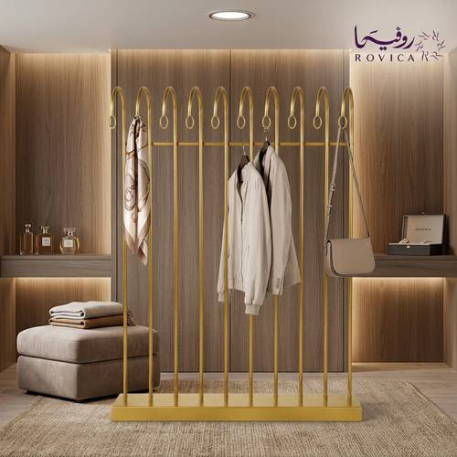 رف معدني ذهبي بتصميم مبتكر لعرض الملابس  Rovica